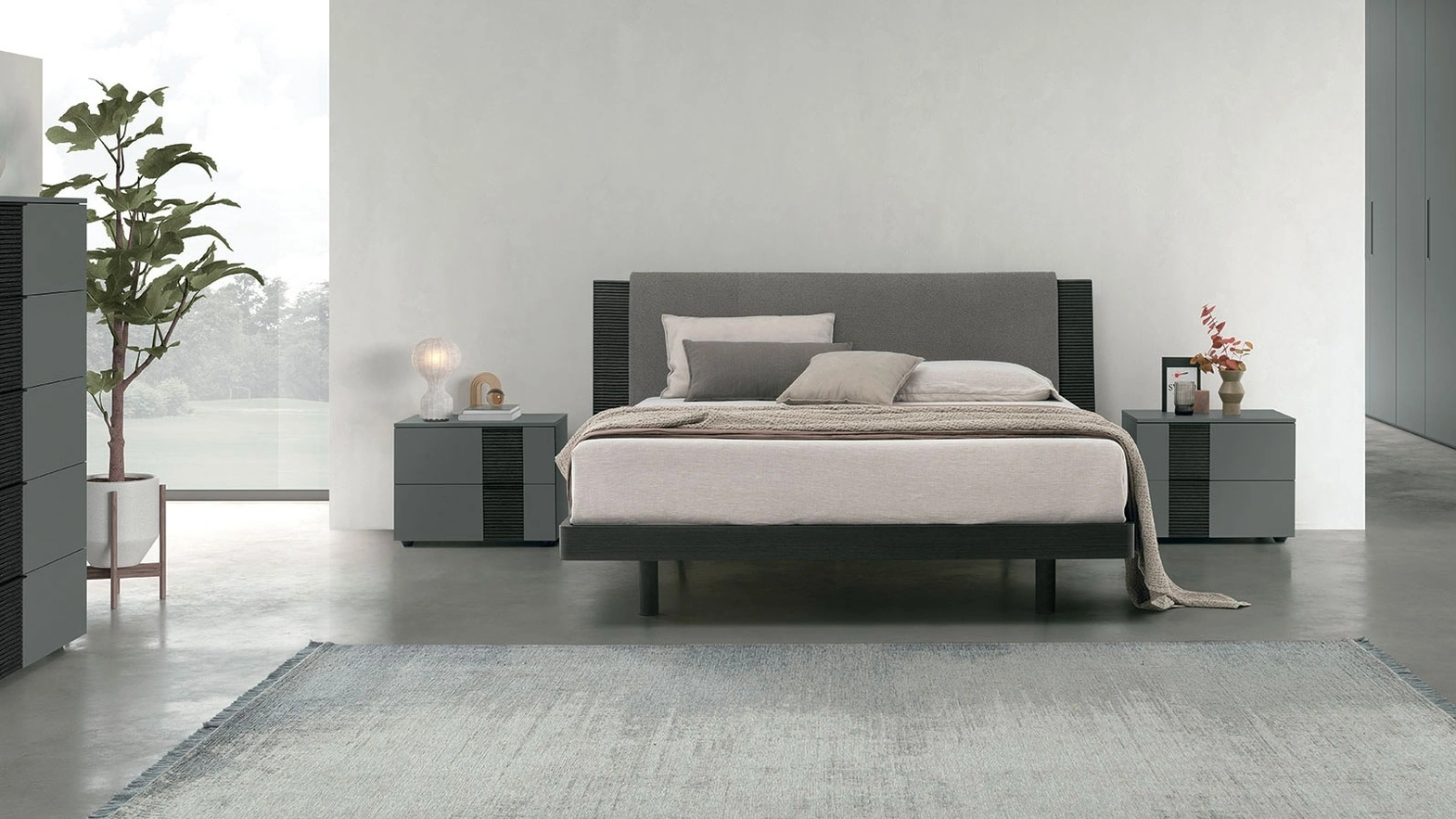 Letto matrimoniale Bliss in materico rovere con testiera ammorbidita da un pannello imbottito di Tomasella
